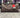SPRAYGROUND BORSONE PEEKING CHARACTER CHECK DUFFLE
